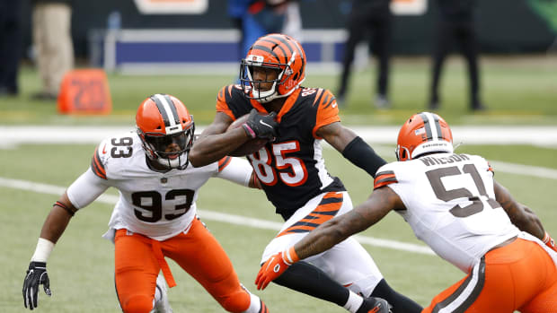 Oct 25, 2020; Cincinnati, Ohio, USA; Cincinnati Bengals wide receiver Tee Higgins (85)breaks past Cleveland Browns middle linebacker B.J. Goodson (93)and linebacker Mack Wilson (51) for the touchdown late in the fourth quarter at Paul Brown Stadium. Mandatory Credit: Joseph Maiorana-USA TODAY Sports